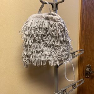 Cute frilly drawstring backpack with handle